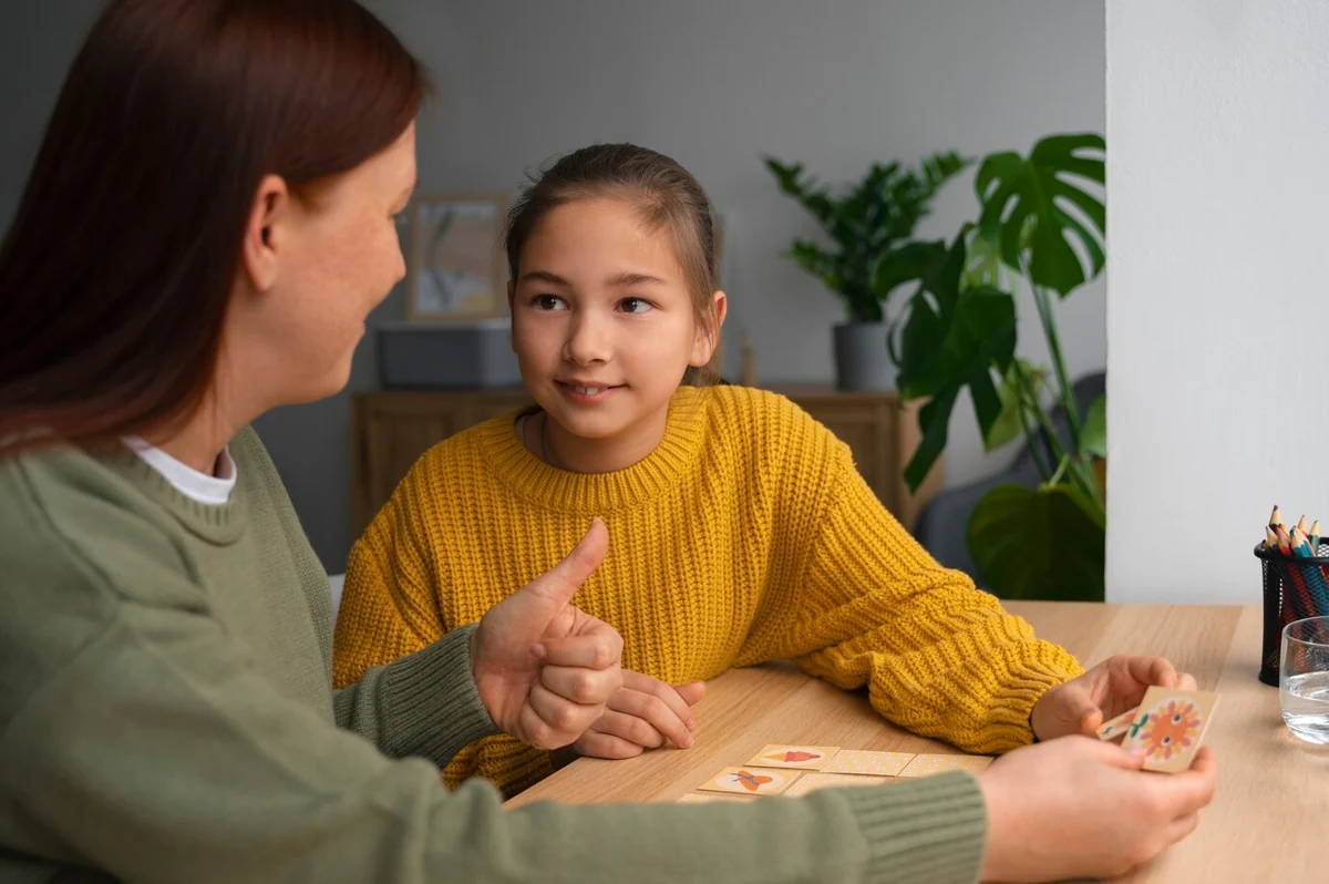 Adult and child communicating during a tabletop activity