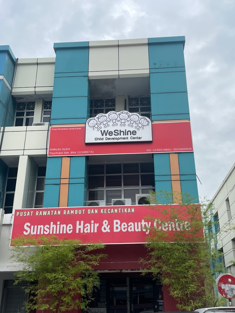 Exterior of WeShine Child Development Centre in USJ, Subang Jaya, with its sign above Sunshine Hair & Beauty Centre